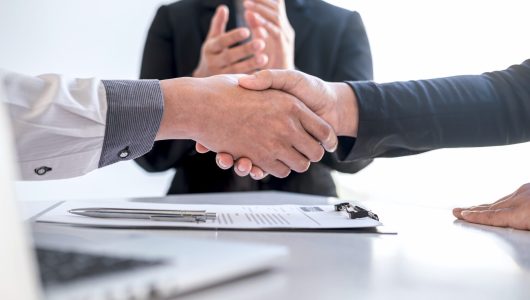 Successful job interview, Image of Boss employer committee or recruiter in suit and new employee shaking hands and clap after good deal negotiation interviewing, career and placement concept.